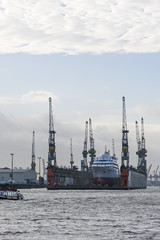 Fototapeta premium Transhipment cranes in Hamburg Port. Hamburg, Germany
