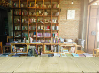 wooden table with blur library books