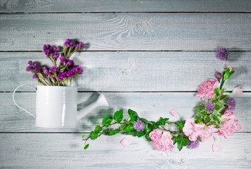 Workplace of the florist. Flower vintage composition on a wooden table. Top view.