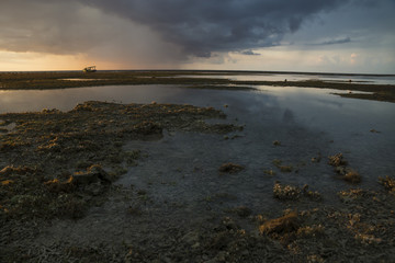 Boat at sunset and low tide at Gili Air, Lombok, Indonesia
