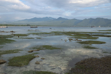 Fototapeta premium VIew to Lombok mountains from the beach of Gili Air during sunset, Indonesia