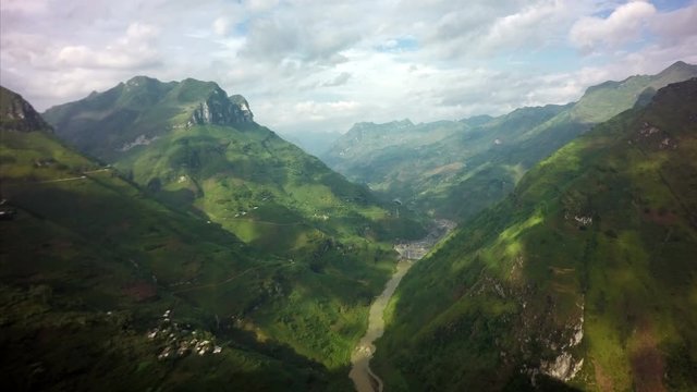 4K Low clouds roll in through the mountains of North Vietnam the pass on Ma Pi Leng.