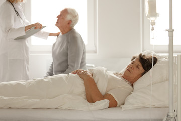Senior woman sleeping in hospital bed