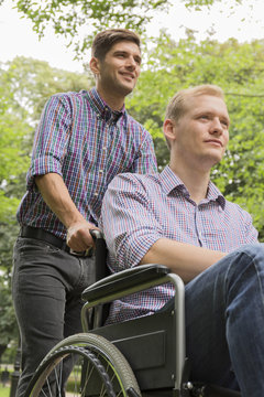 Man pushing brother on wheelchair