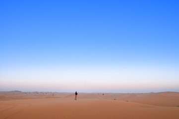 Fototapeta na wymiar Man in the vast desert