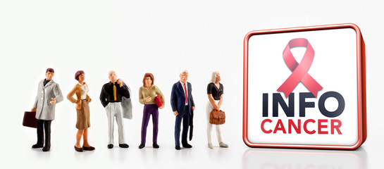 miniature people - A group of people standing in front a information board