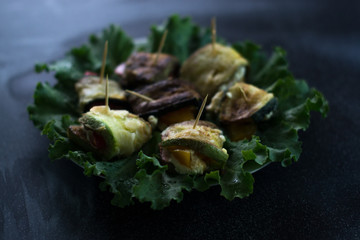Vegetable barbecue on a black matte background.