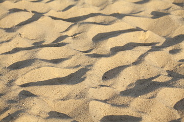 Sand mit Schatten an einem Strand