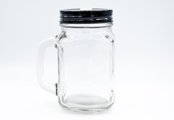 Glass bottle with black cap on isolated white background.