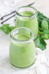 Vanilla, mint, spinach and coconut milk detox green smoothie, vertical