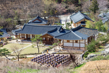 Fototapeta na wymiar Kimchi pots in front of traditional Korean houses at Wanju county, South Korea