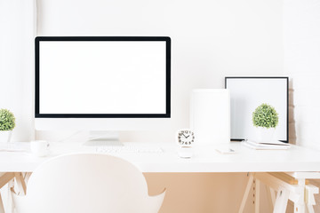 Bright designer desktop with blank computer