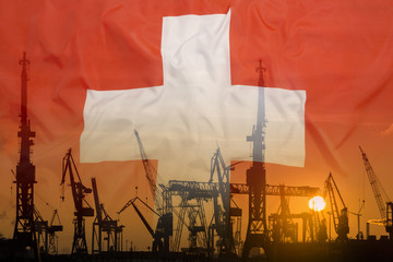 Industrial concept with Switzerland flag at sunset