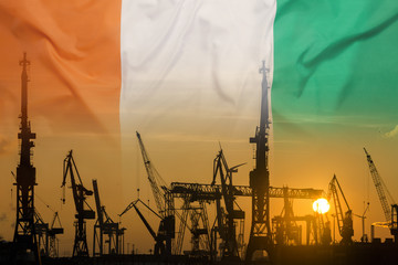 Industrial concept with Ivory Coast flag at sunset
