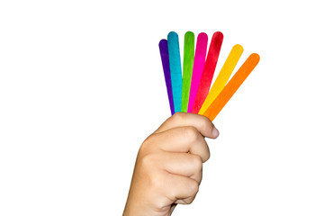 Boy hands holding colorful ice cream stick