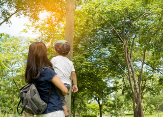 mom and child stay in the park on holiday