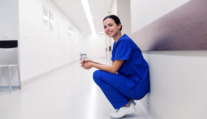 Naklejka na ściany i meble happy doctor or nurse at hospital corridor
