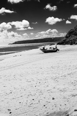 Stranded boat in the beach of Salema (Algarve, Portugal)