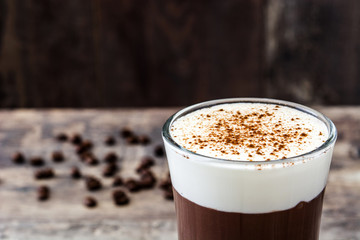 Irish coffee in glass on wooden table
