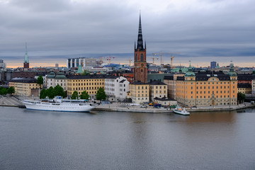Fototapeta na wymiar Panorama of Stockholm with the church Riddarholmskyrkan on a cloudy day