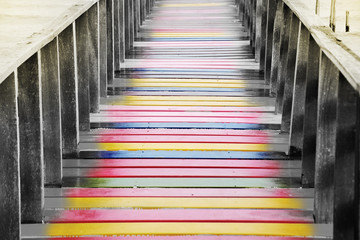 Colorful wooden bridge at sea view