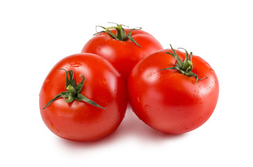 Red fresh tomatoes on a white isolated background