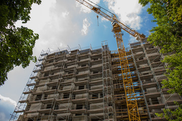  Lots of tower construction with crane.