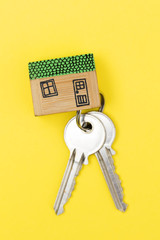 Model house with set of home keys. Housing concept