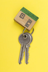 Model house with set of home keys. Housing concept