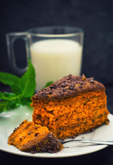 Cake with chocolate, honey and mint. Black background. Top view. Close-up