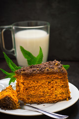 Cake with chocolate, honey and mint. Black background. Top view. Close-up