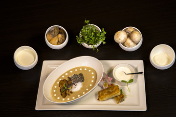 Fototapeta na wymiar Cream soup with white mushrooms. Cream soup in interior design