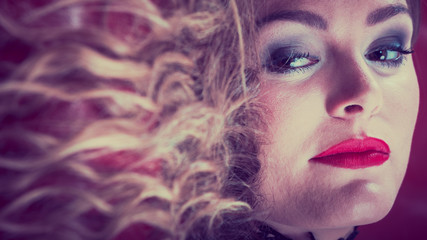 Woman lying on sofa, blond hair