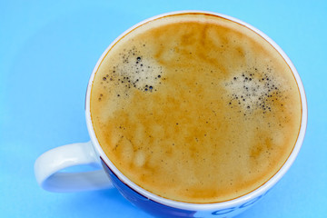 A cup of coffee on a blue background