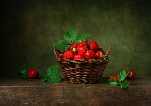 Still life with strawberries in a basket