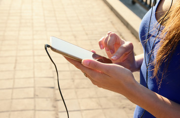 Obraz na płótnie Canvas Close up of woman hands holds smart phone
