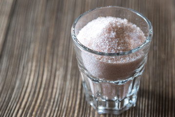 Glass of pink sea salt
