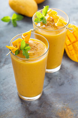 Mango smoothie in tall glasses