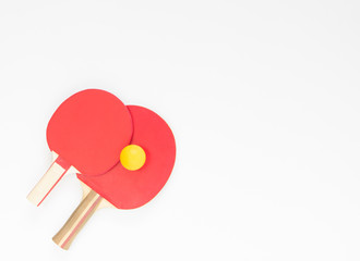 Sport background. Red ping-pong rackets and balls. Flat lay, top view.