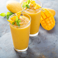 Mango smoothie in tall glasses