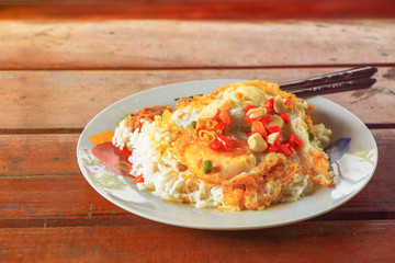 Fried rice with fried egg on table