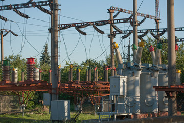 Electrical substation infrastructure with close up on electrical circuit breakers.