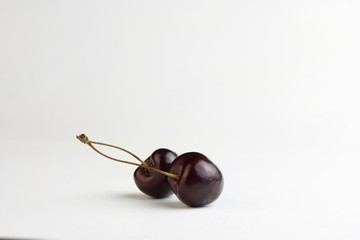 Two heart shaped cherry berries isolated on white background cutout
