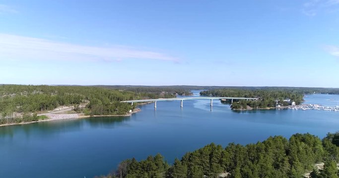 Lovon silta, Cinema 4k aerial view over islands and the lovo bridge connecting kemionsaari and kasnas, in the finnish archipelago, in Varsinais-suomi, Finland