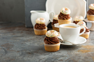 Coffee and cream cupcakes decorated with donuts