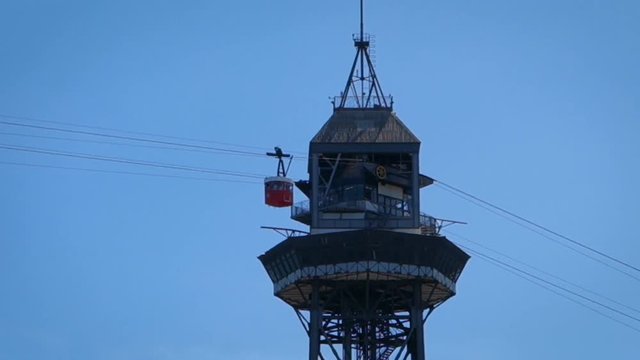 2 cabins arribing at Tower cableway in Port Vell, named Torre Jaume I. It's a main attraction in Barcelona.Barcelona is a vibrant modern city at the Mediterranean with lots of attractions.50fps video