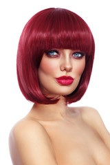 Fototapeta premium Beautiful fashion redhead girl with bob haircut and stylish make-up over white background, copy space