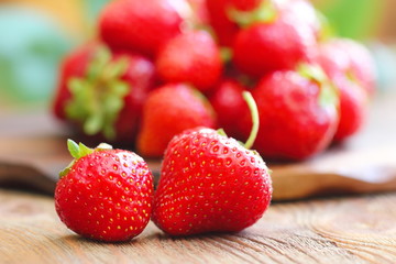 Ripe fresh strawberries on wooden table