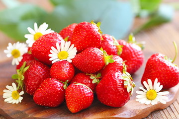 Ripe fresh strawberries on wooden table