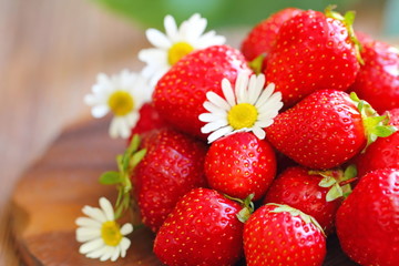 Ripe fresh strawberries on wooden table
